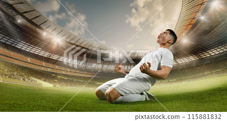 Soccer player celebrates triumphant moment, kneeling on field. Stadium lights shine brightly, illuminating energetic scene. Soccer player celebrates triumphant moment, kneeling on field. Stadium lights shine brightly, illuminating energetic scene. 115881832