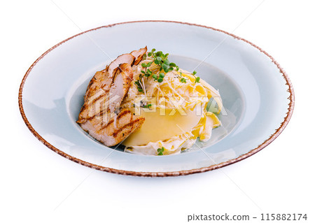 Elegant grilled chicken breast with cheese and cream sauce Elegant grilled chicken breast with cheese and cream sauce 115882174