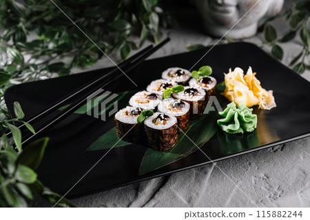 Gourmet sushi platter on elegant black plate Gourmet sushi platter on elegant black plate 115882244