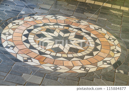 Small multi-colored floor tiles from which the eight-pointed star flower is assembled, which is of great importance in Islamic culture and religion. Well-known world sacred symbols. Small multi-colored floor tiles from which the eight-pointed star flower is assembled, which is of great importance in Islamic culture and religion. Well-known world sacred symbols. 115884877