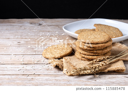 Healthy oatmeal cookies on wooden table Healthy oatmeal cookies on wooden table 115885478
