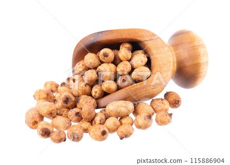 Tiger nuts in wooden scoop, isolated on white background. Pile of chufa nuts, earth almond or chufa sedge. Cyperus esculentus. Tiger nuts in wooden scoop, isolated on white background. Pile of chufa nuts, earth almond or chufa sedge. Cyperus esculentus. 115886904