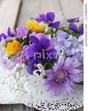 Blue pansies and hydrangeas Blue pansies and hydrangeas 115886940