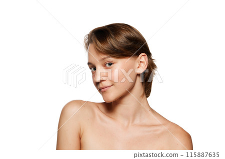 Natural beauty woman with bare shoulders looking at camera with light smile against white studio background. Model with smooth skin. Natural beauty woman with bare shoulders looking at camera with light smile against white studio background. Model with smooth skin. 115887635