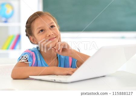 Portrait of girl studing with laptop at classroom Portrait of girl studing with laptop at classroom 115888127