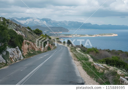 empty coastal road in the morning with the sea and mountains in the background. Ai generative 115889395