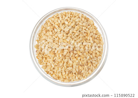 Sesame seeds in glass bowl isolated on white background. Top view. Flat lay Sesame seeds in glass bowl isolated on white background. Top view. Flat lay 115890522