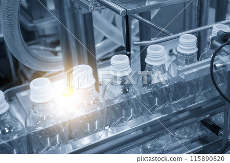 The  empty drinking water bottles  on the conveyor belt for filling process. 115890820