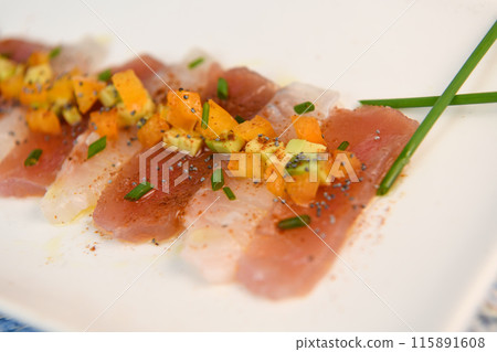 FISH CEVICHE RECIPE, SEA BREAM AND TUNA, AVOCADO, BELL PEPPER, CHILLI, CHIVES, LEMON, OLIVE OIL FISH CEVICHE RECIPE, SEA BREAM AND TUNA, AVOCADO, BELL PEPPER, CHILLI, CHIVES, LEMON, OLIVE OIL 115891608
