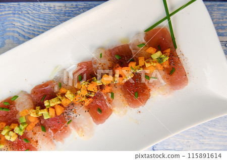 FISH CEVICHE RECIPE, SEA BREAM AND TUNA, AVOCADO, BELL PEPPER, CHILLI, CHIVES, LEMON, OLIVE OIL FISH CEVICHE RECIPE, SEA BREAM AND TUNA, AVOCADO, BELL PEPPER, CHILLI, CHIVES, LEMON, OLIVE OIL 115891614