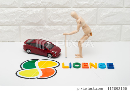 Image of a passenger car, elderly driver and driver's license 115892166