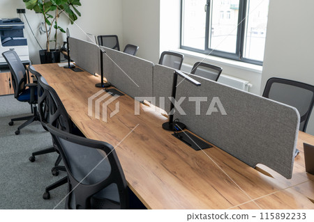Coworking library. Table and chairs in the office. 115892233
