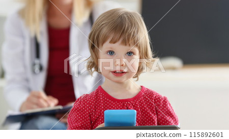 Portrait of little girl on background of doctor in white coat. Portrait of little girl on background of doctor in white coat. 115892601