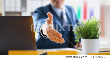 Man in business suit stretching out his hand for handshake closeup 115892729
