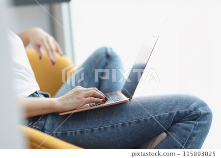 Female hands on keyboard on laptop closeup 115893025