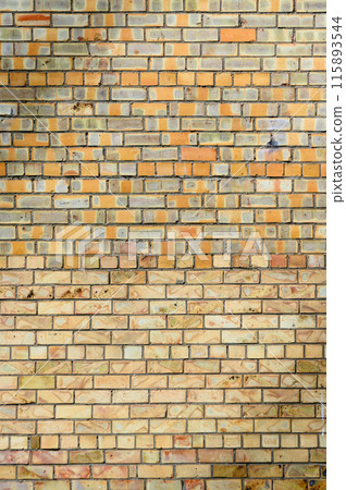 yellow brick wall in spring. Stones for a modern concept background with copy space yellow brick wall in spring. Stones for a modern concept background with copy space 115893544