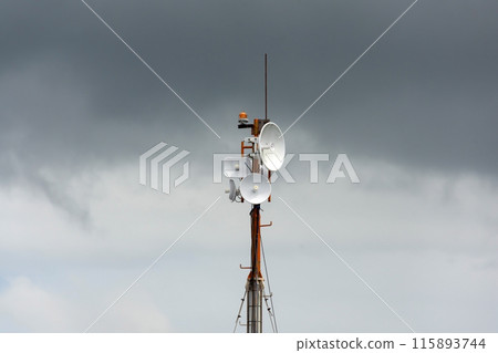 Wireless data station aerial view Against a cloudy sky. Cell tower 115893744