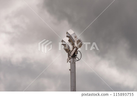 Large spotlight against a cloudy sky 115893755