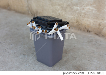 cigarettes in the trash can. to give up smoking cigarettes in the trash can. to give up smoking 115893849