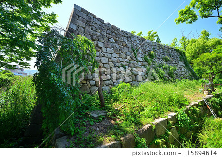 Stone walls and moat of the main citadel of Yodo Castle in Yamashiro Province 115894614