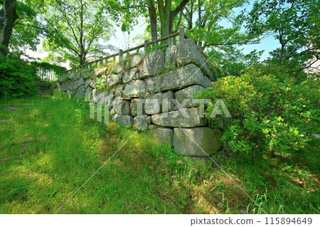Stone walls and moat of the main citadel of Yodo Castle in Yamashiro Province 115894649