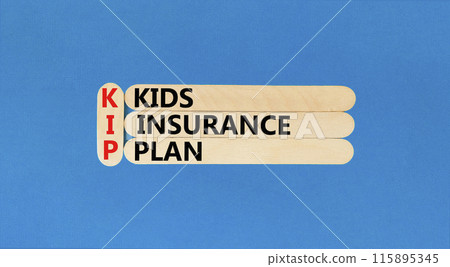 KIP kids insurance plan symbol. Concept words KIP kids insurance plan on beautiful wooden stick. Beautiful blue background. Business KIP kids insurance plan concept. Copy space. 115895345