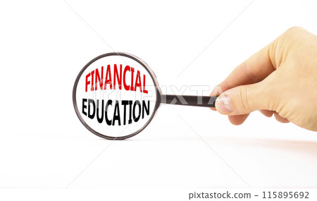 Financial education symbol. Concept words Financial education in beautiful magnifying glass. Beautiful white paper background. Businessman hand. Business Financial education concept. Copy space. 115895692