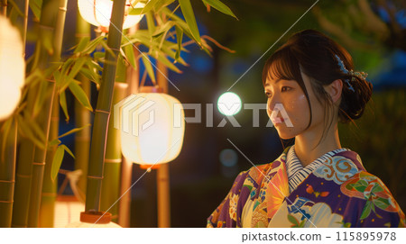 Tanabata Festival: Beautiful woman in yukata standing next to bamboo 115895978