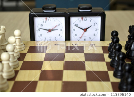 A chess board and a chess clock. Chess competitions. A chess board and a chess clock. Chess competitions. 115896140