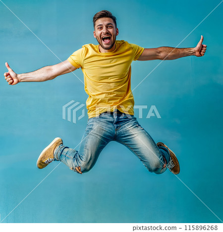 Man in yellow shirt jumping in the air with his hands in the air. Man in yellow shirt jumping in the air with his hands in the air. 115896268