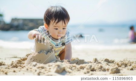 Japanese kids building sand castles on the beach in summer 115896903