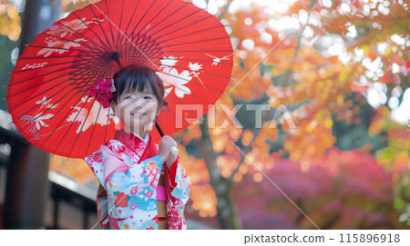 A girl in a kimono holding a red Japanese umbrella celebrating Shichigosan at a shrine A girl in a kimono holding a red Japanese umbrella celebrating Shichigosan at a shrine 115896918