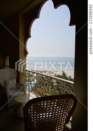 RAS AL KHAIMAH, UNITED ARAB EMIRATES - JUN 11, 2019: Balcony with sea view in a luxurious hotel room in a five-star hotel 115896942