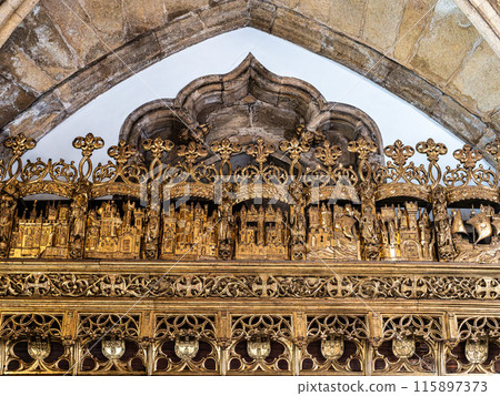 Gold gleeming Manueline choir stalls at Mosteiro de Santa Cruz monastery at Coimbra, Portugal Gold gleeming Manueline choir stalls at Mosteiro de Santa Cruz monastery at Coimbra, Portugal 115897373