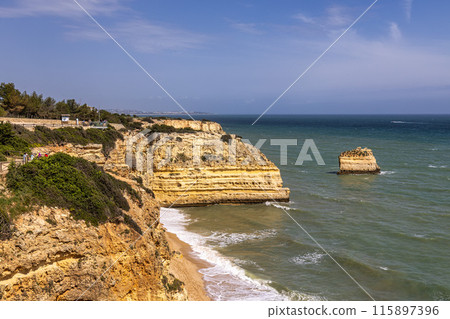 Praia da Marinha Beach among rock islets and cliffs seen from Seven Hanging Valleys Trail, Algarve, Portugal 115897396