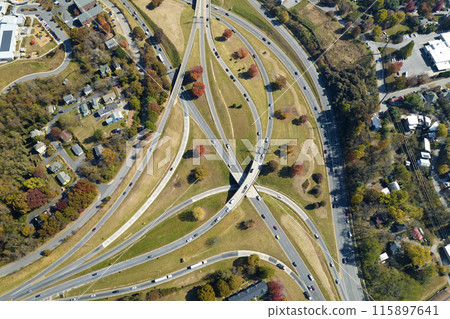 Aerial view of american freeway intersection in fall season in Asheville, North Carolina with fast moving cars and trucks. USA transportation infrastructure concept 115897641