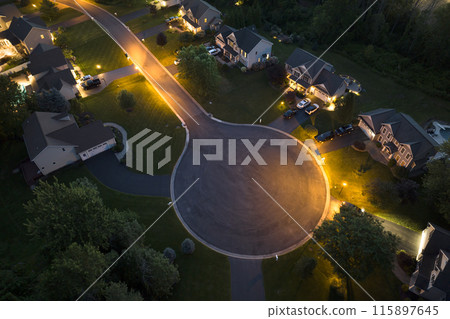 Cul de sac street dead end at night and private residential houses in rural suburban sprawl area in Rochester, New York. Upscale suburban homes with large backyards Cul de sac street dead end at night and private residential houses in rural suburban sprawl area in Rochester, New York. Upscale suburban homes with large backyards 115897645
