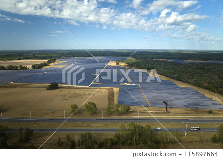 Aerial view of big sustainable electric power plant with many rows of solar photovoltaic panels for producing clean electrical energy. Renewable electricity with zero emission concept 115897663