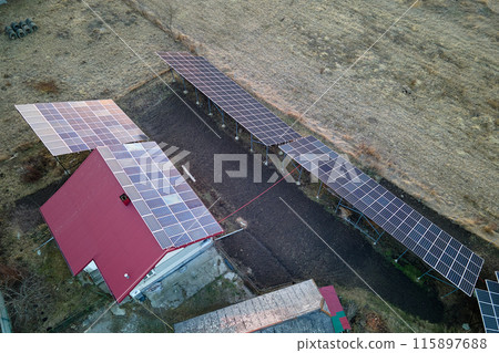 Residential house with rooftop covered with solar photovoltaic panels for producing of clean ecological electrical energy in suburban rural area. Concept of autonomous home 115897688
