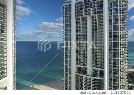 Expensive highrise hotels and condos on Atlantic ocean shore in Sunny Isles Beach city. American tourism infrastructure in southern Florida 115897692
