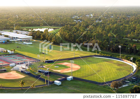 Sports facilities at public school in Florida, USA. American football stadium, tennis court and baseball diamond sport infrastructure 115897787