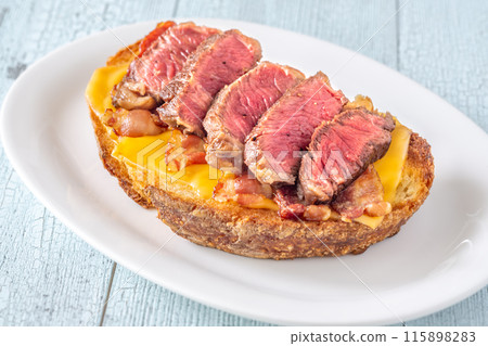Bacon and steak bruschetta 115898283