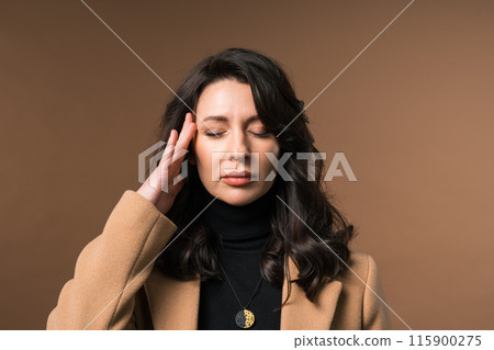 Mature woman is suffered, headache. Migraine, massages temples, magnetic storms 115900275