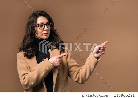Smart Smiling Businesswoman Pointing At Right Side, Copy Space Or Advertising. Smart Smiling Businesswoman Pointing At Right Side, Copy Space Or Advertising. 115900281