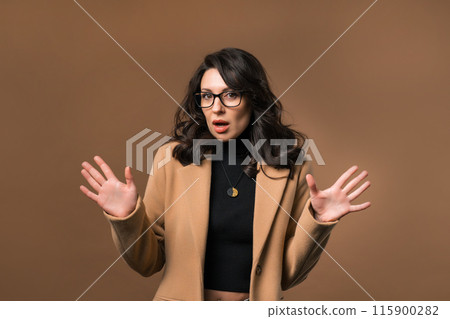 Mature woman afraid something, shock on beige backdrop. Unbelievable, bad news. Mature woman afraid something, shock on beige backdrop. Unbelievable, bad news. 115900282