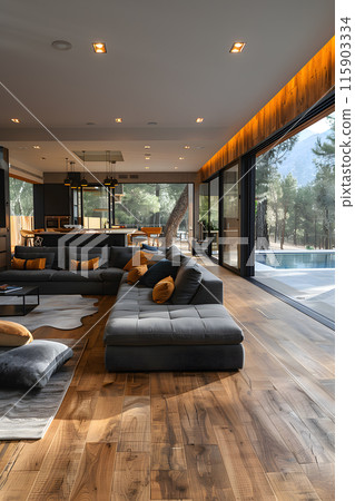 A living room with a large hardwood couch and laminate flooring, overlooking a swimming pool in the background 115903334