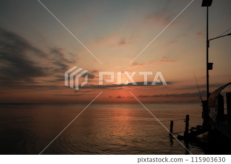 sunrise on the beach pier bridge with a clear sky sunrise on the beach pier bridge with a clear sky 115903630
