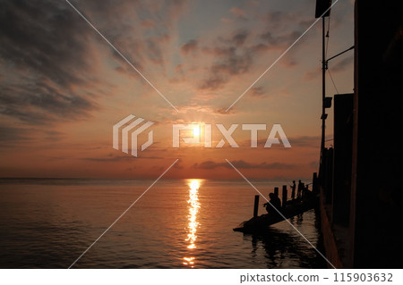 sunrise on the beach pier bridge with a clear sky sunrise on the beach pier bridge with a clear sky 115903632