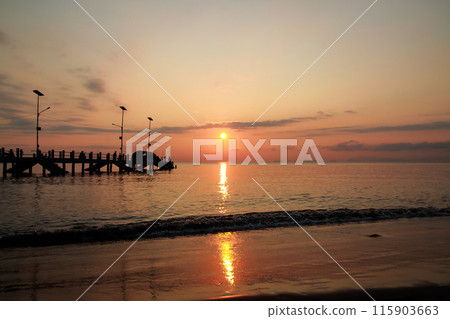 sunrise on the beach pier bridge with a clear sky sunrise on the beach pier bridge with a clear sky 115903663