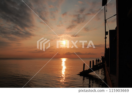 sunrise on the beach pier bridge with a clear sky sunrise on the beach pier bridge with a clear sky 115903669